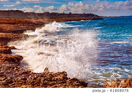 Sea splashing on rocks Sea splashing on rocks 61808076
