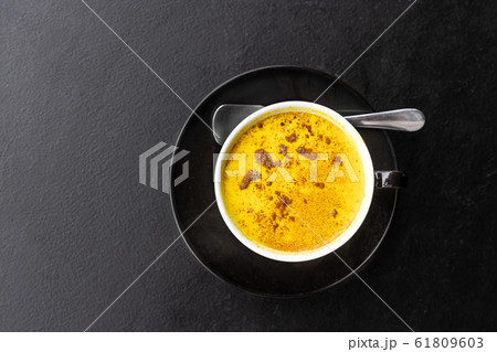 Serving of aromatic turmeric black coffee against 61809603