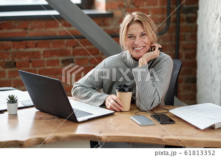 Excited business lady in office 61813352