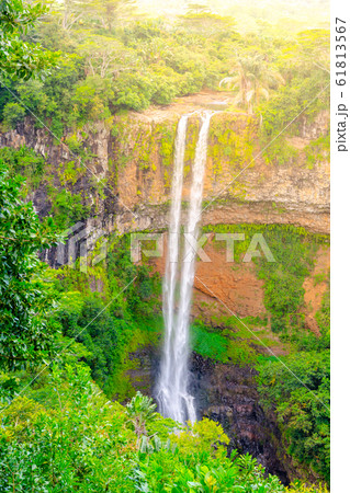 Chamarel Waterfall in lush tropical greenery of Mauritius, Indian Ocean Chamarel Waterfall in lush tropical greenery of Mauritius, Indian Ocean 61813567