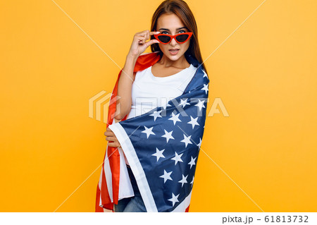 young beautiful girl in sunglasses, with American young beautiful girl in sunglasses, with American 61813732