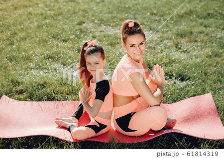Sports family in a summer park 61814319