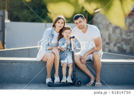 Cute family playing in a summer park 61814730