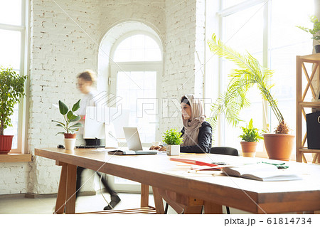 Portrait of a beautiful arabian businesswoman wearing hijab while working 61814734