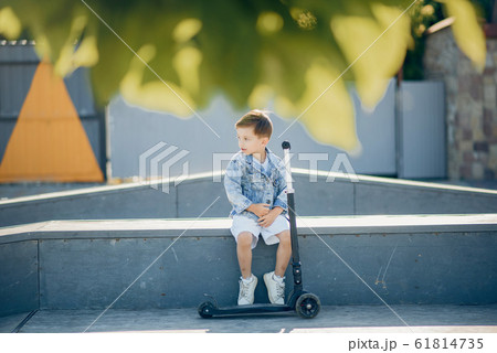 Cute little children playing in a summer park Cute little children playing in a summer park 61814735