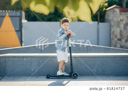 Cute little children playing in a summer park 61814737