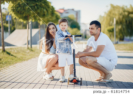 Cute family playing in a summer park 61814754