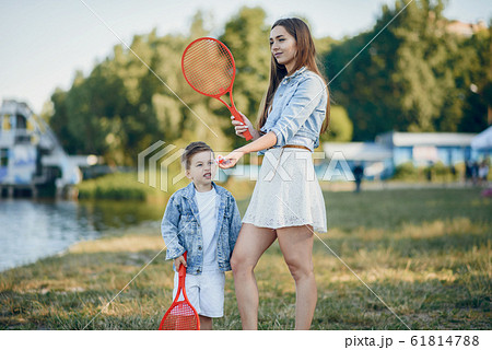 Mother with son playing in a summer park 61814788