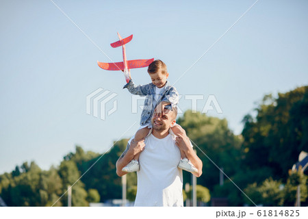 Cute family playing in a summer park 61814825