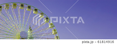 Ferris wheel on the background of purple sky 61814916