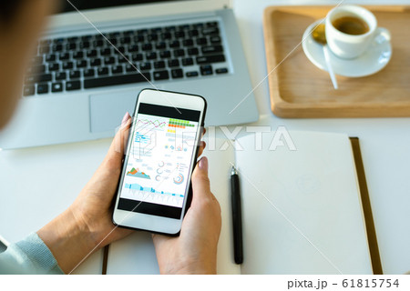 Hands of young economist over open notebook scrolling through financial data Hands of young economist over open notebook scrolling through financial data 61815754