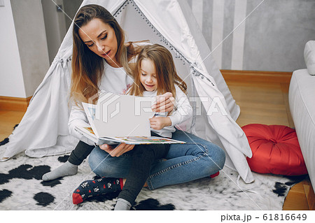 Mother with little daughter at home 61816649