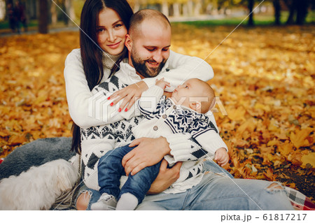 Family with son in a autumn park 61817217