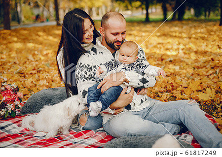 Family with son in a autumn park 61817249