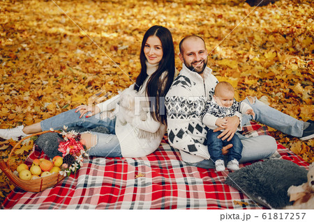 Family with son in a autumn park 61817257
