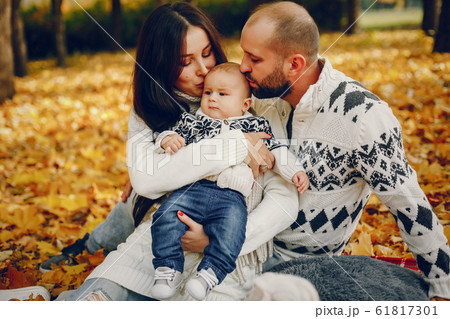 Family with son in a autumn park 61817301