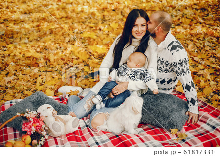 Family with son in a autumn park 61817331