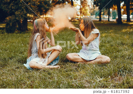 Two cute girls have fun in a summer park 61817392