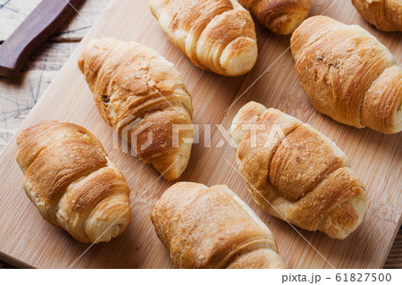 Croissants with chocolate filling on wooden 61827500
