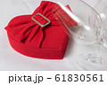 Wine glass and heart shaped box With wedding rings 61830561