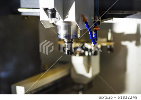 Milling machine tool with mill in chuck preparing to process metal detail at industrial manufacture factory Milling machine tool with mill in chuck preparing to process metal detail at industrial manufacture factory 61832248