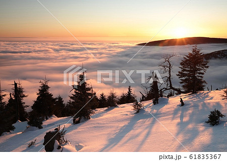 Winter landscape in the mountains during sunset Winter landscape in the mountains during sunset 61835367