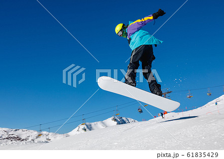 Snowboarder and a blue sky 61835429