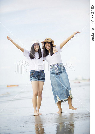 two cheerful asian teenager happiness on vacation two cheerful asian teenager happiness on vacation 61838488