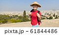 Girl is standing on hill and looking at Athens, 61844486