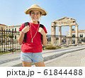 Happy girl is standing on street of Athens near 61844488