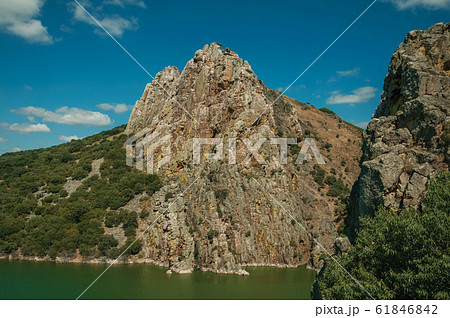 Valley with cliffs and the Tagus River at the Monfrague National Park Valley with cliffs and the Tagus River at the Monfrague National Park 61846842