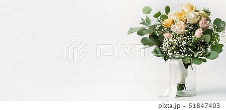 Flower composition, wedding bouquet with ribbon, boutonniere Flower composition, wedding bouquet with ribbon, boutonniere 61847403
