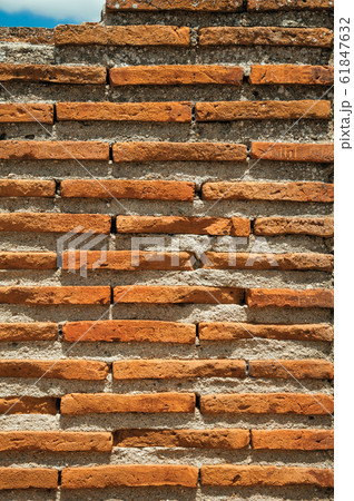 Wall made of small bricks 61847632