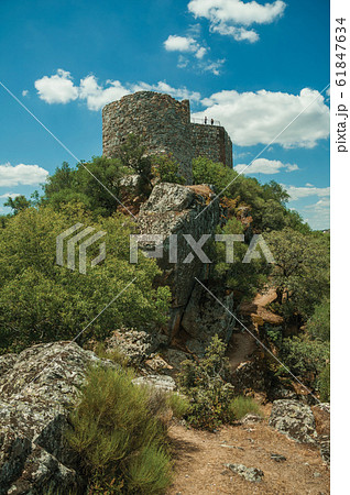 Castle on top of rocky cliff near the Tagus River at the Monfrague National Park Castle on top of rocky cliff near the Tagus River at the Monfrague National Park 61847634