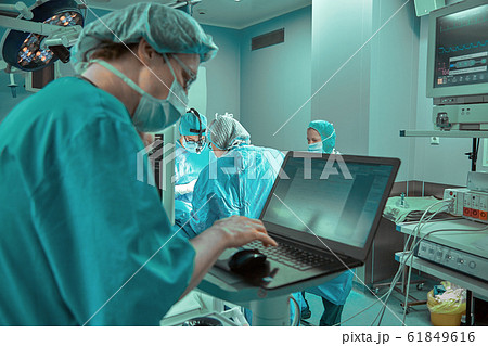 Surgeons team in the operating room, portraits close-up. modern operating, plastic surgery. Beauty industry 61849616
