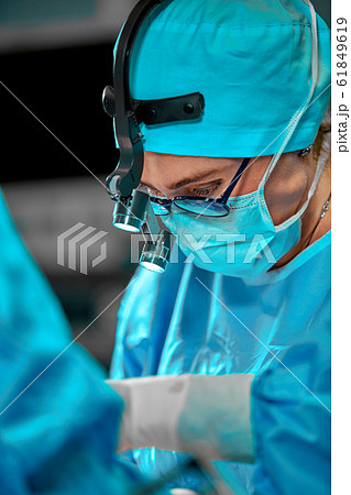 Surgeons team in the operating room, portraits close-up. modern operating, plastic surgery. Beauty industry 61849619