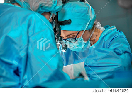 Surgeons team in the operating room, portraits close-up. modern operating, plastic surgery. Beauty industry 61849620