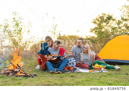 travel, tourism, hike, picnic and people concept - 61849756