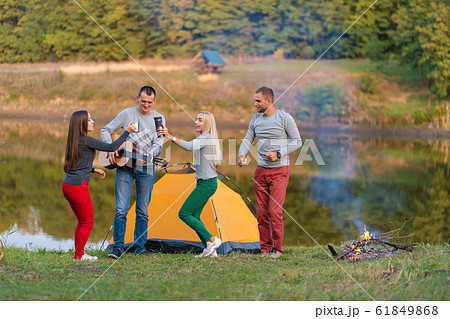 Group of happy friends with guitar, having fun 61849868