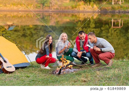 travel, tourism, hike, picnic and people concept - 61849869