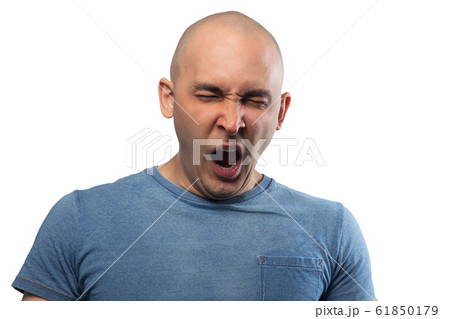 Photo of young bald yawning man in blue tee shirt 61850179