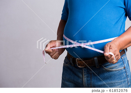 Overweight or fat adult man in very tight jeans Overweight or fat adult man in very tight jeans 61852076