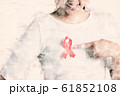 Closeup of red badge ribbon on woman chest 61852108