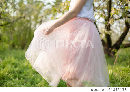 Young attractive girl walks in spring green park Young attractive girl walks in spring green park 61852133