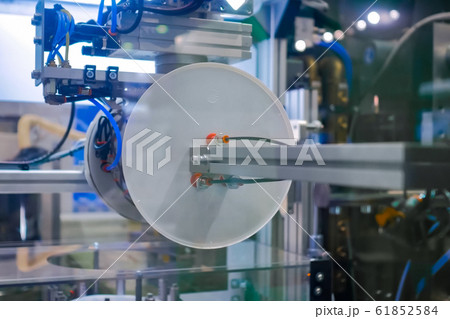 Automatic robotic arm manipulator with suction cups moves plastic lids, covers 61852584