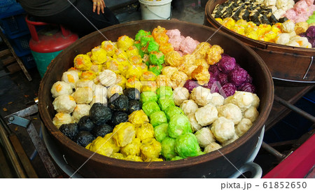 Colorful steamed dim sum, chinese dumpling in a Colorful steamed dim sum, chinese dumpling in a 61852650