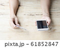woman use mobile smartphone and credit card for online shopping 61852847