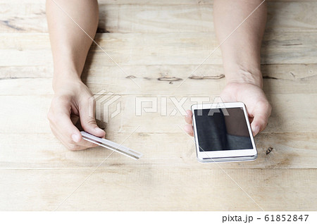 woman use mobile smartphone and credit card for online shopping woman use mobile smartphone and credit card for online shopping 61852847