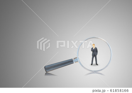 Magnifying glass looking at businessman. Magnifying glass looking at businessman. 61858166