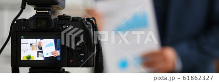 Male in suit and tie show stats graph pad 61862327